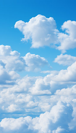 Blue sky background with white clouds. Cumulus white clouds in the clear blue sky.の素材