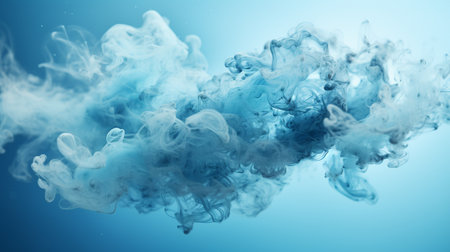 Blue ink in water on a blue background. Abstract background for design.の素材