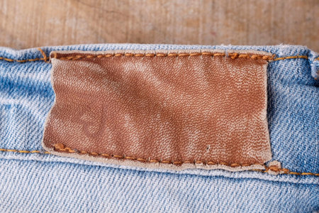 Clothing labels on wooden vintage background
