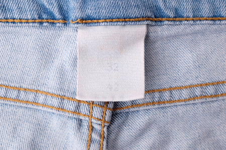 Clothing labels on wooden vintage backgroundの写真素材