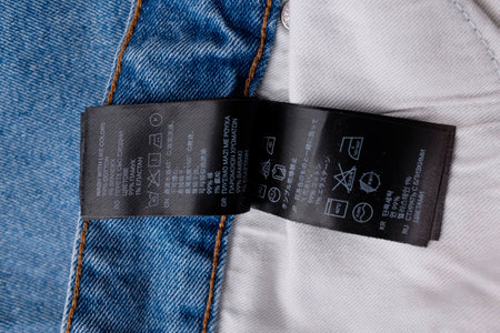 Clothing labels on wooden vintage background