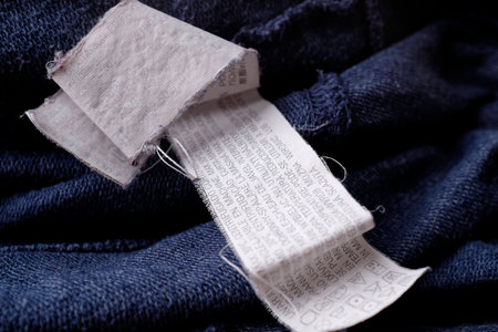 Clothing labels on wooden vintage backgroundの写真素材