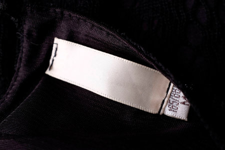 Clothing labels on wooden vintage backgroundの写真素材