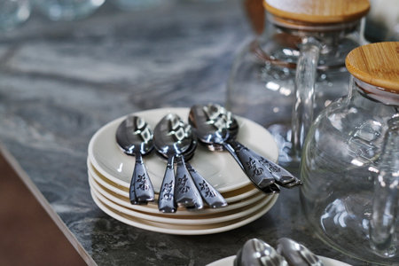 Ceramic tableware and cutlery in the kitchen.の写真素材