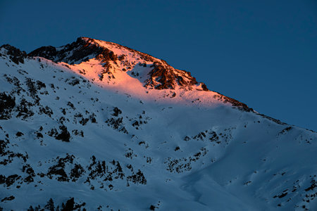 sunset on a snowy mountain in the Pyreneesの写真素材