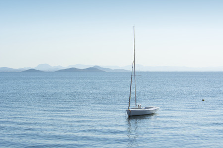 Small Vessel, without Sail on Mast- La Manga, Mar Menor Side, Cabo de Palos, Cartagena and San Javier, Murcia, Spain, Europeの写真素材