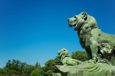 Bronze Lions, Monument of Alfonso XII, Pond of the Park of the Pleasant Retreat, Madrid, Spainの写真素材