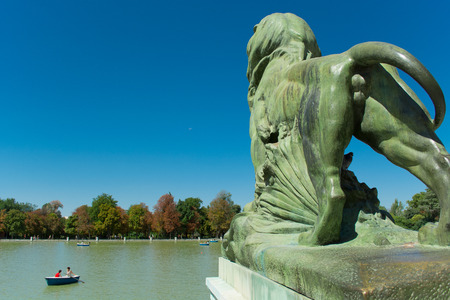 Bronze Lion back side, Monument of Alfonso XII, Pond of the Park of the Pleasant Retreat, Madrid, Spainのeditorial素材