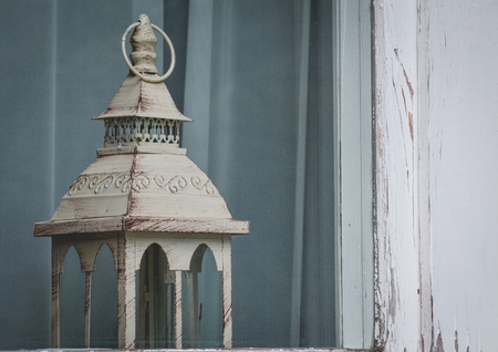vintage lantern in the frayed window. Ancient suggestionの写真素材