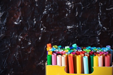 A set of colorful markers, with a place for copy space on black background.の写真素材