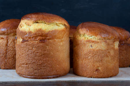 Freshly baked Easter cake cools down. Lots of different sizes. Traditional Kulich, Paska Easter...