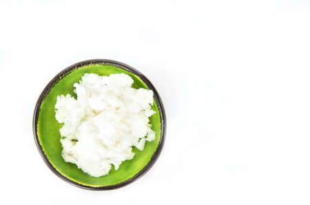 Natural Coconut oil on a white background. Healthy coconut butter. Top view. copy spaceの写真素材