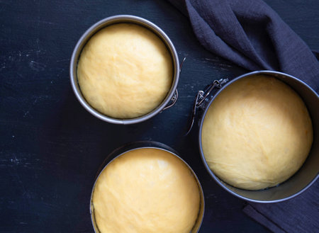 Easter cake dough in a metal pan. Preparation before baking Easter cake.の写真素材