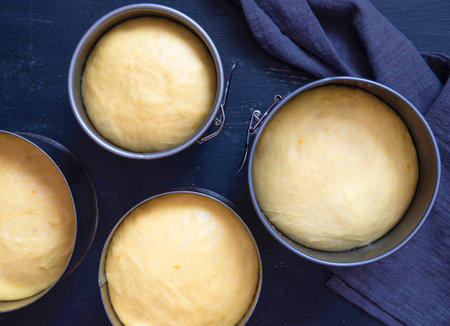 Easter cake dough in a metal pan. Preparation before baking Easter cake.の写真素材