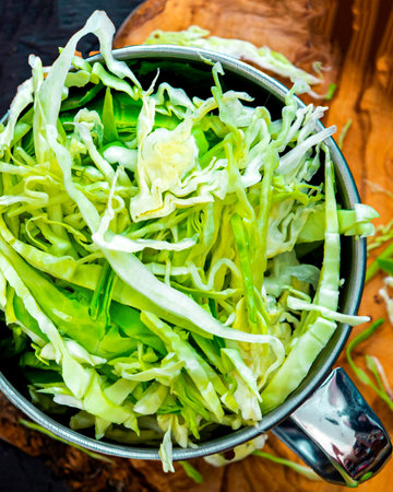 Shredded cabbage for salad, pickling Flat lay background for healthy food concept.