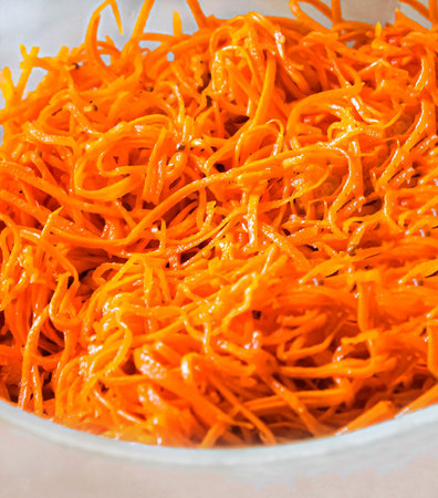 Korean carrot spicy salad in the bowlの写真素材