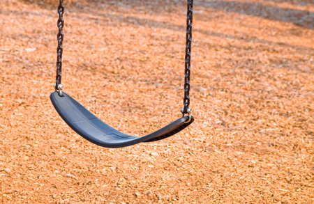 empty swing at the playgroundの写真素材