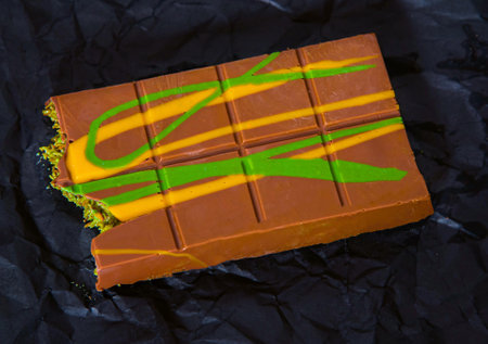 Chocolate is a dessert made with milk chocolate, fried kadaifi dough, and pistachio paste.の写真素材
