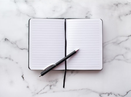 Notepad, pen on white background