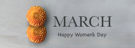 Two orange Dhalia flowers and March. Happy Women's day text in English