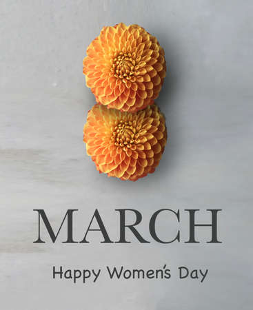 Two orange Dhalia flowers and "March. Happy Women's day" text in Englishの写真素材