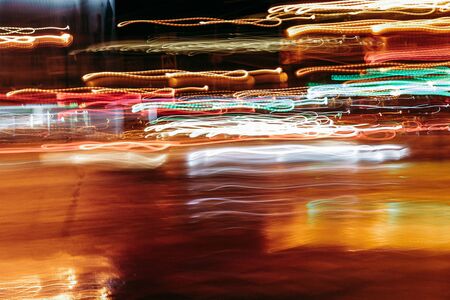 Long exposure night lights in motion. Light from transport and from city lights