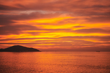 Beautiful sunset on the sea. Colorful sky and clouds.の写真素材