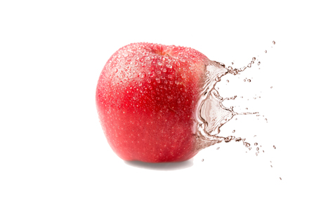 Wet juicy red appleの写真素材