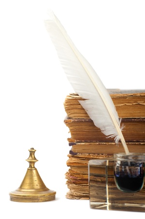 Pen in the inkstand and old booksの写真素材