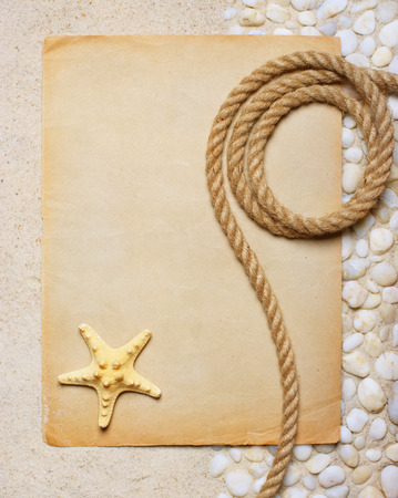 Blank sheet of paper on the sea sand for beach partyの写真素材