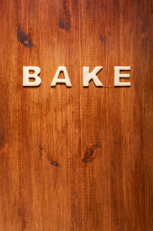 Letters of dough on the wooden table. Kitchen backgroundの写真素材
