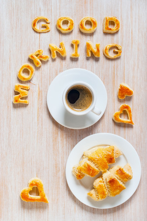 Fresh croissants and coffee on the tableの写真素材