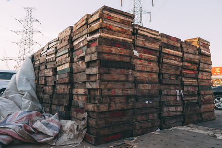 Beijing , China - Dec 21, 2014: colorful crates massive stacked on wooden pallets in a market. the pallets shown the name of owernsのeditorial素材