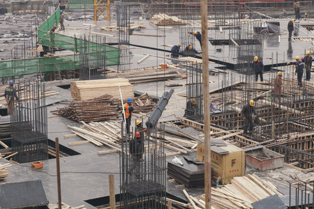 18 Dec,2014 Beijing. Work activity on a construction site in City with cranes and workers,building train stationのeditorial素材