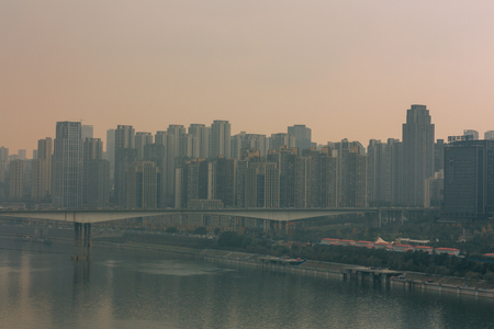 Chongqing, China - Dec 22, 2015: The view  of foggy crowded city bridges beside the  jialing riverのeditorial素材