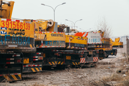 14,Dec,2014 - Beijing China,Yellow Crane trucks,on the roadのeditorial素材