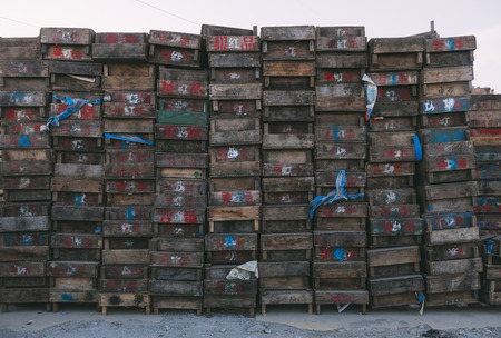 Beijing , China - Dec 21, 2014: colorful crates massive stacked on wooden pallets in a market. the pallets shown the name of owernsの写真素材