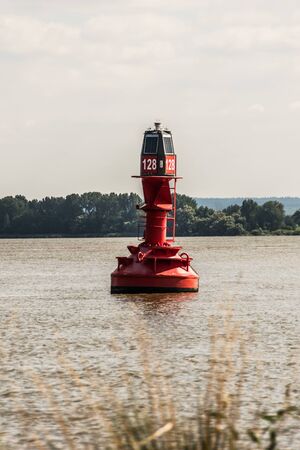 red buoy on the river elbeの写真素材