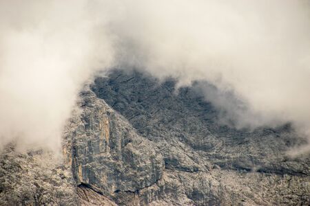 clouds coming down the mountainsの写真素材