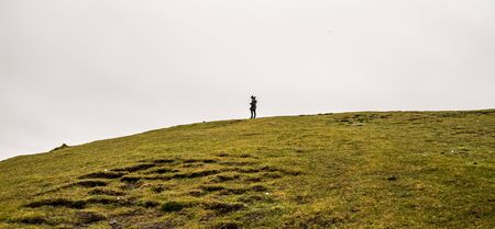 lonely person on a cliffの写真素材