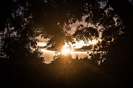 sun goes down in beautiful lightの写真素材