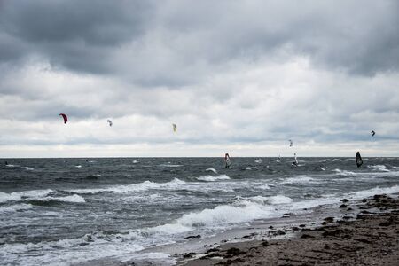 many kite surfer along the beachの写真素材