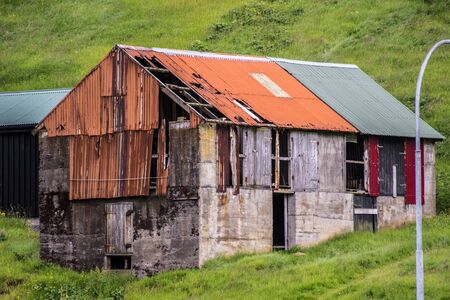rusty shed in the faroer highlandsの写真素材