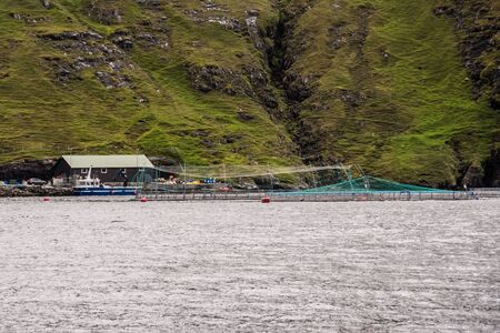 fish farm in a fjordの写真素材