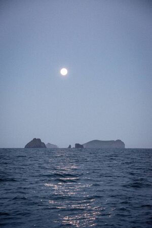 full moon above the westmaenner islandの写真素材