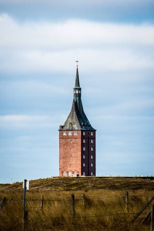 Square lighthouse on an island