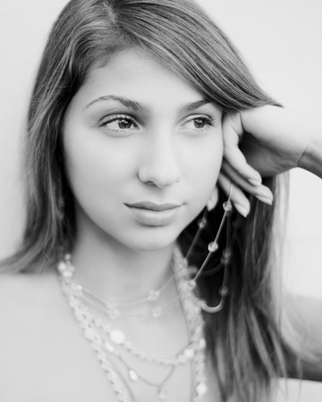 A young pretty woman daydreaming outdoorsの写真素材