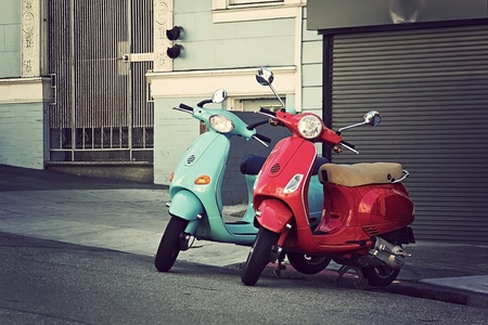 Two cute motorbikes parked on San Francisco street の写真素材