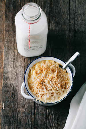 Southern baked mac and cheese with a vintage bottle of milkの写真素材