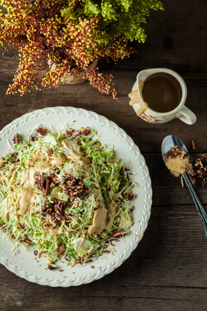 Gourmet caesar with lettuce, shredded parmesan, toasted pecans and mustard vinaigretteの写真素材